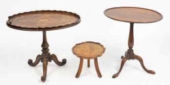 An oval inlaid mahogany side table. The