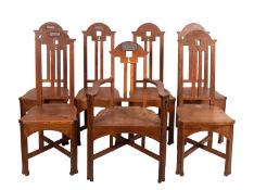 A set of seven oak chairs in Arts and Crafts style, early 20th century; including one elbow chair,