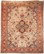 A Tabriz carpet, the ivory field with a