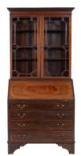 A mahogany and glazed bureau bookcase in