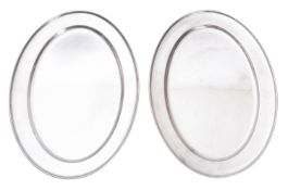 Two modern oval stainless steel oval mea