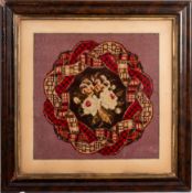 A pair of woven fabric floral pictures,