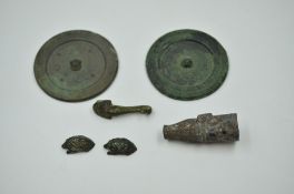 Two Bronze Mirrors and Four Bronze Fittings. Han or Later.