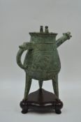 A Bronze Ritual Tripod Wine Vessel and Cover, He. 19-20th Century.