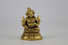 A Rare Miniature seated Jambhala in Gold, 19th century. Price on Request