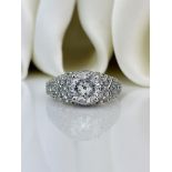 Outstanding ornate 1.50ct Diamond and Platinum Solitaire Ring with diamond shoulders