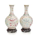 A pair of famille rose 'phoenix' bottle vases Qianlong six-character red enamel mark but late Qing