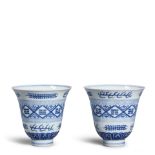 A PAIR OF BLUE AND WHITE 'TRIGRAM' BELL-SHAPED CUPS (2, box for each)