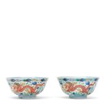 A PAIR OF WUCAI 'DRAGON AND PHOENIX' BOWLS Daoguang seal marks and of the period (2, wood stand ...
