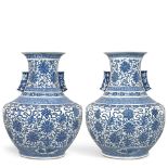 A PAIR OF MASSIVE BLUE AND WHITE 'LOTUS AND BAJIXIANG' VASES Late Qing dynasty/Republic period (2)