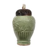 A 'LONGQUAN' CELADON-GLAZED 'FLORAL' VASE, REDUCED Ming dynasty (wood cover and stand)