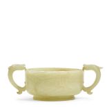 A PALE CELADON JADE TWO HANDLED 'DRAGON' CUP Late Ming/early Qing dynasty