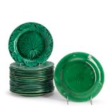 TWENTY-ONE WEDGWOOD GREEN-GLAZED LEAF-FORM MAJOLICA PLATES