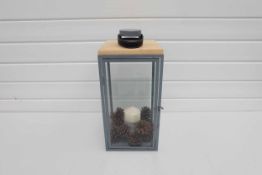 Grey Lantern Candle Holder With Leather Handle and Wooden Top.