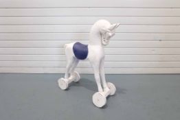 Ornamental Wooden Horse on Wheels With Painted Blue Saddle.