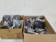 Large assortment of switched control panels.