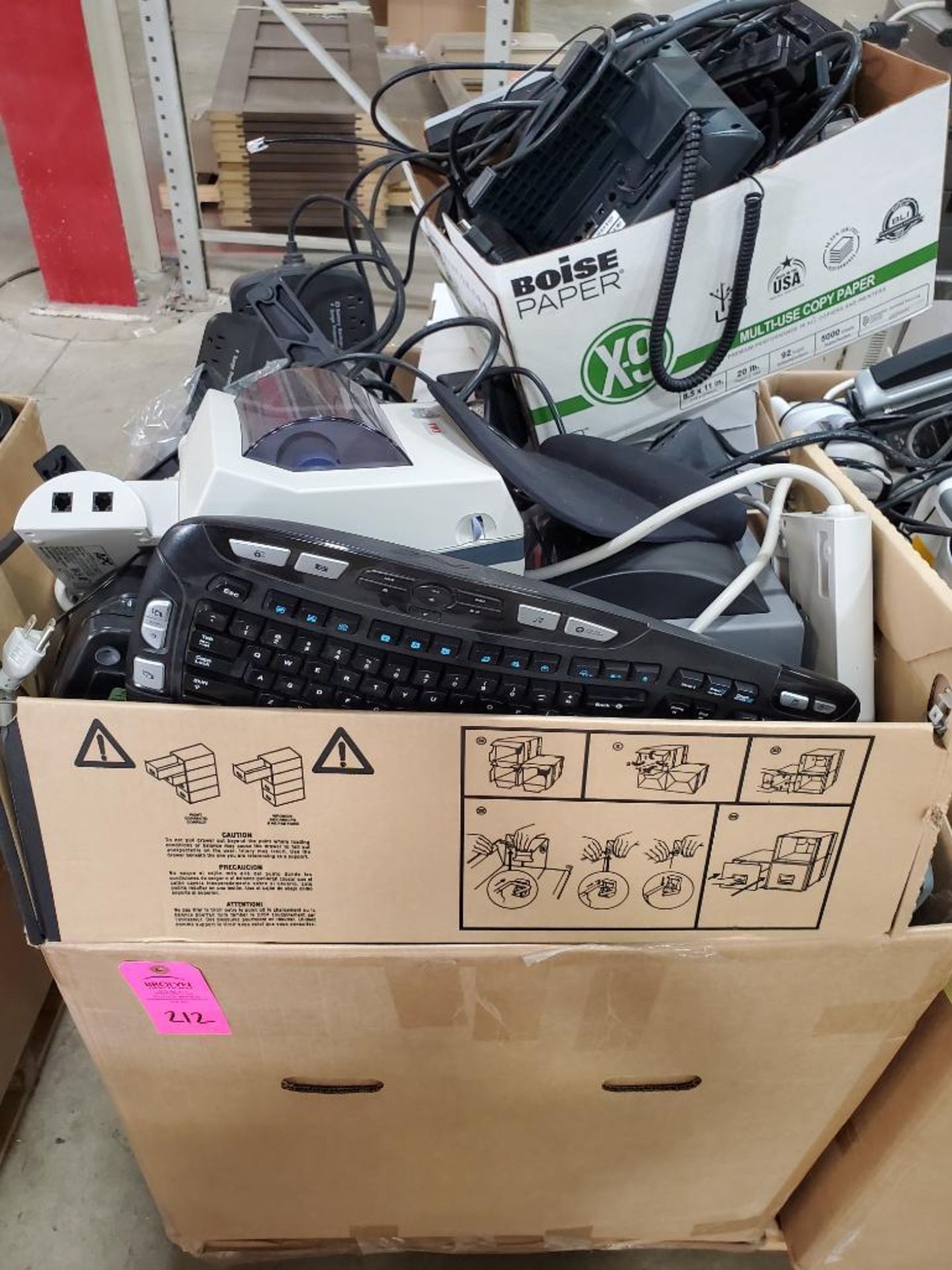 Box of assorted computers peripherals.