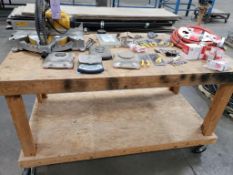 Table with contents. Dewalt saw, scales, etc.