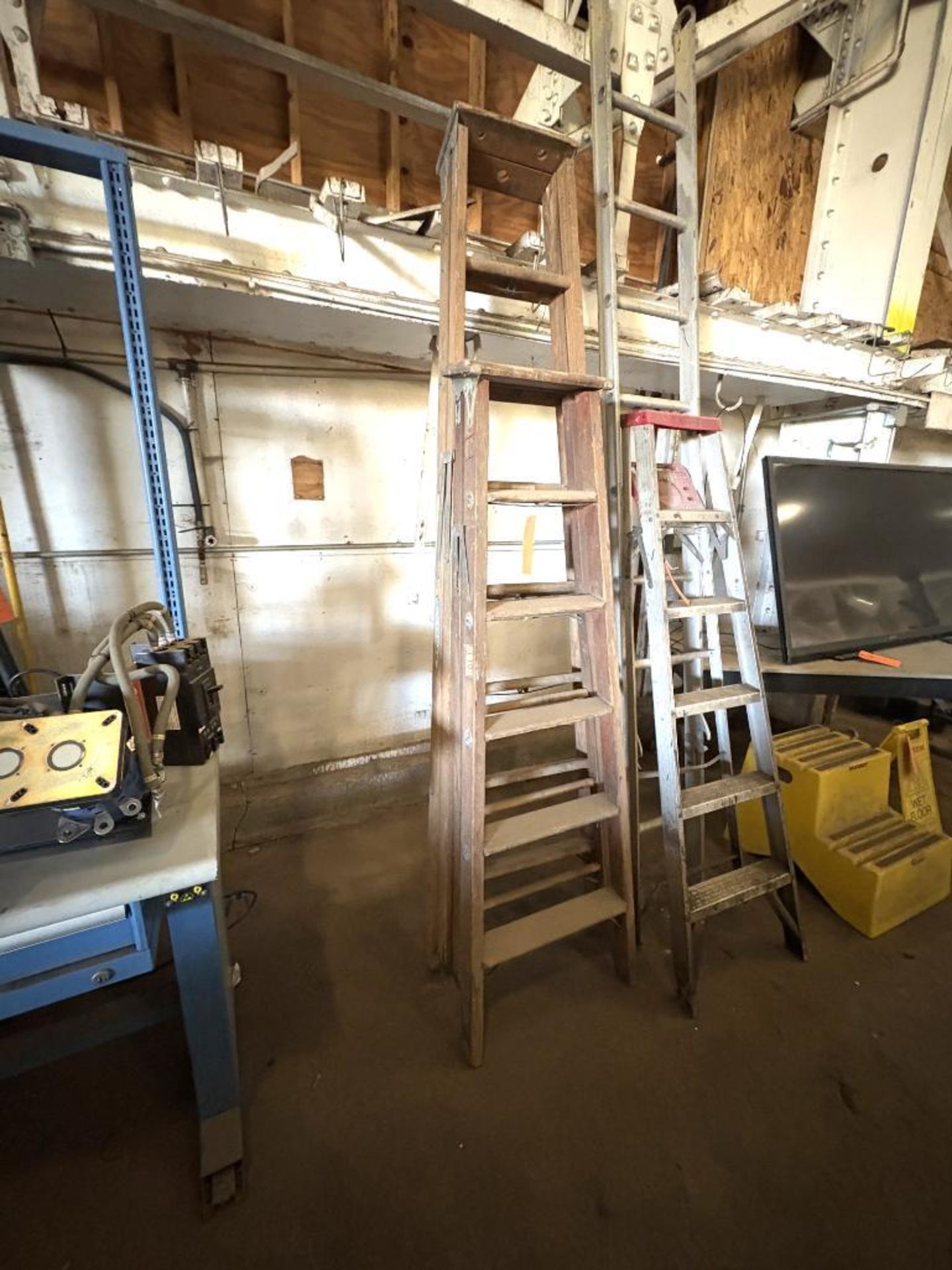 (2) WOODEN LADDERS, (1) 8' WERNER AND (1) 6'