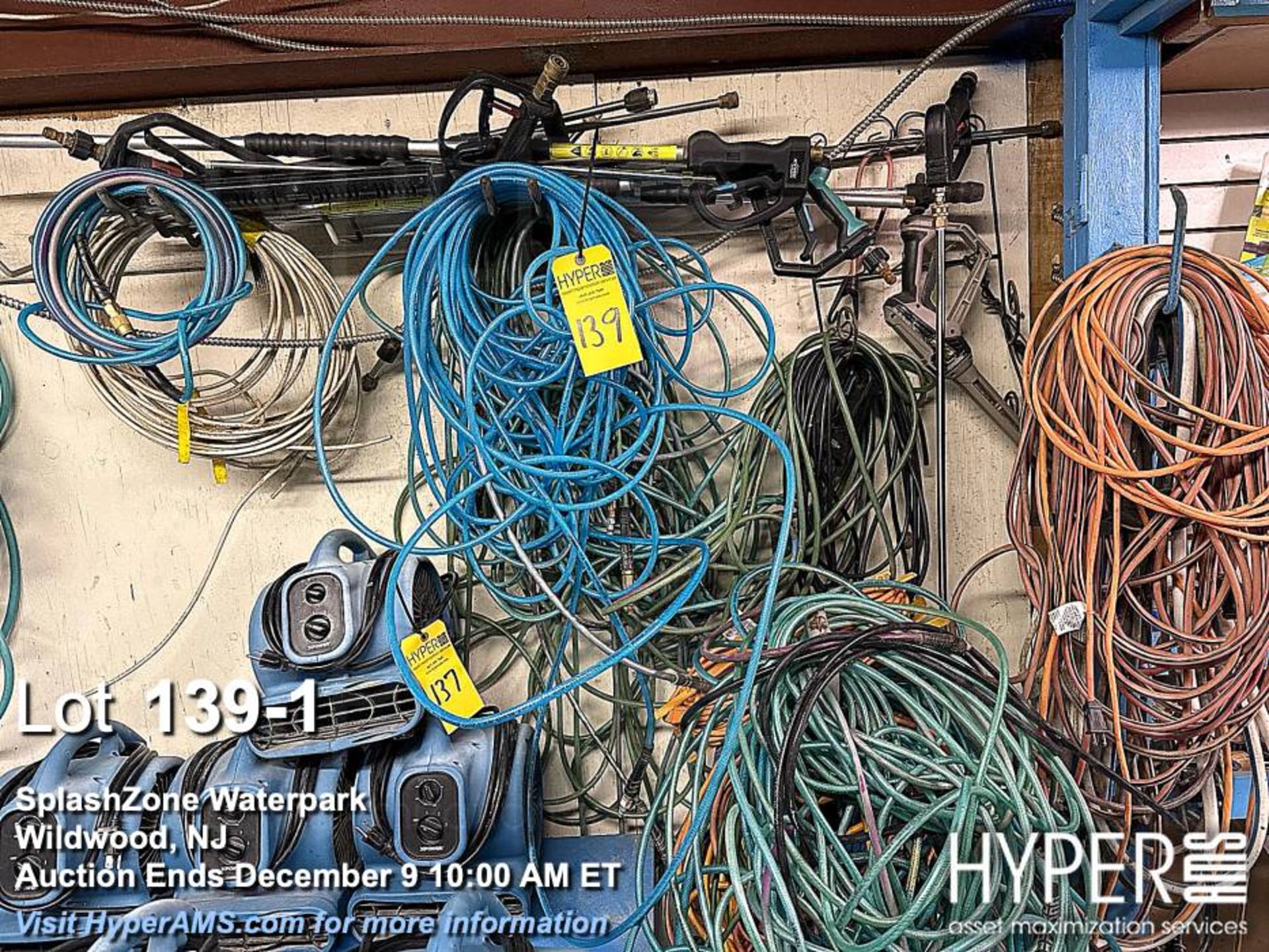 Lot of extension cords, paint hose, air hose, extension cords, pressure washing wands as pictured