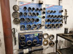 LOT OF OTC TRUCK WHEEL BEARING LOCKOUT SOCKETS ON WALL
