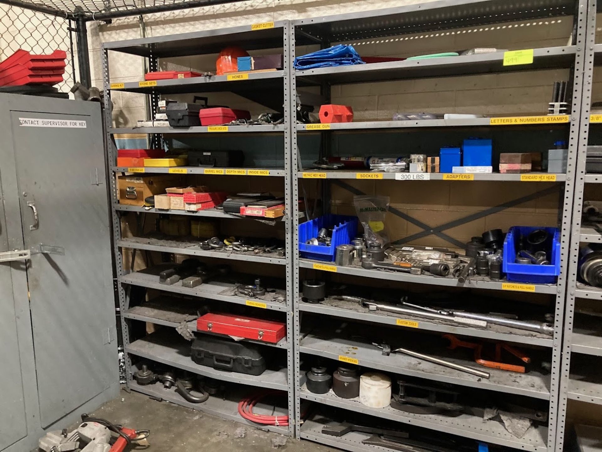 Metal storage shelving, 4 sections with misc. empty tool boxes, clamps and wrenches