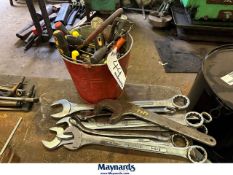 bucket of tools with combination wrenches
