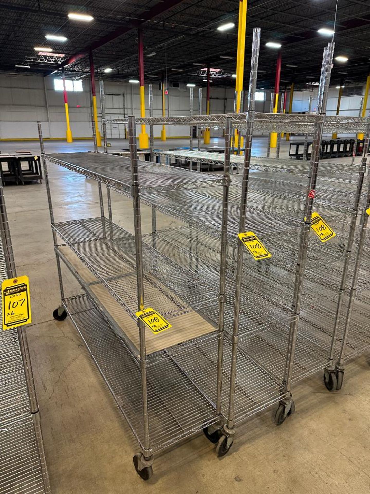 { Choice of lots: 107, 108 } (6) Assorted Size Rolling Metro Racks ($10 ...
