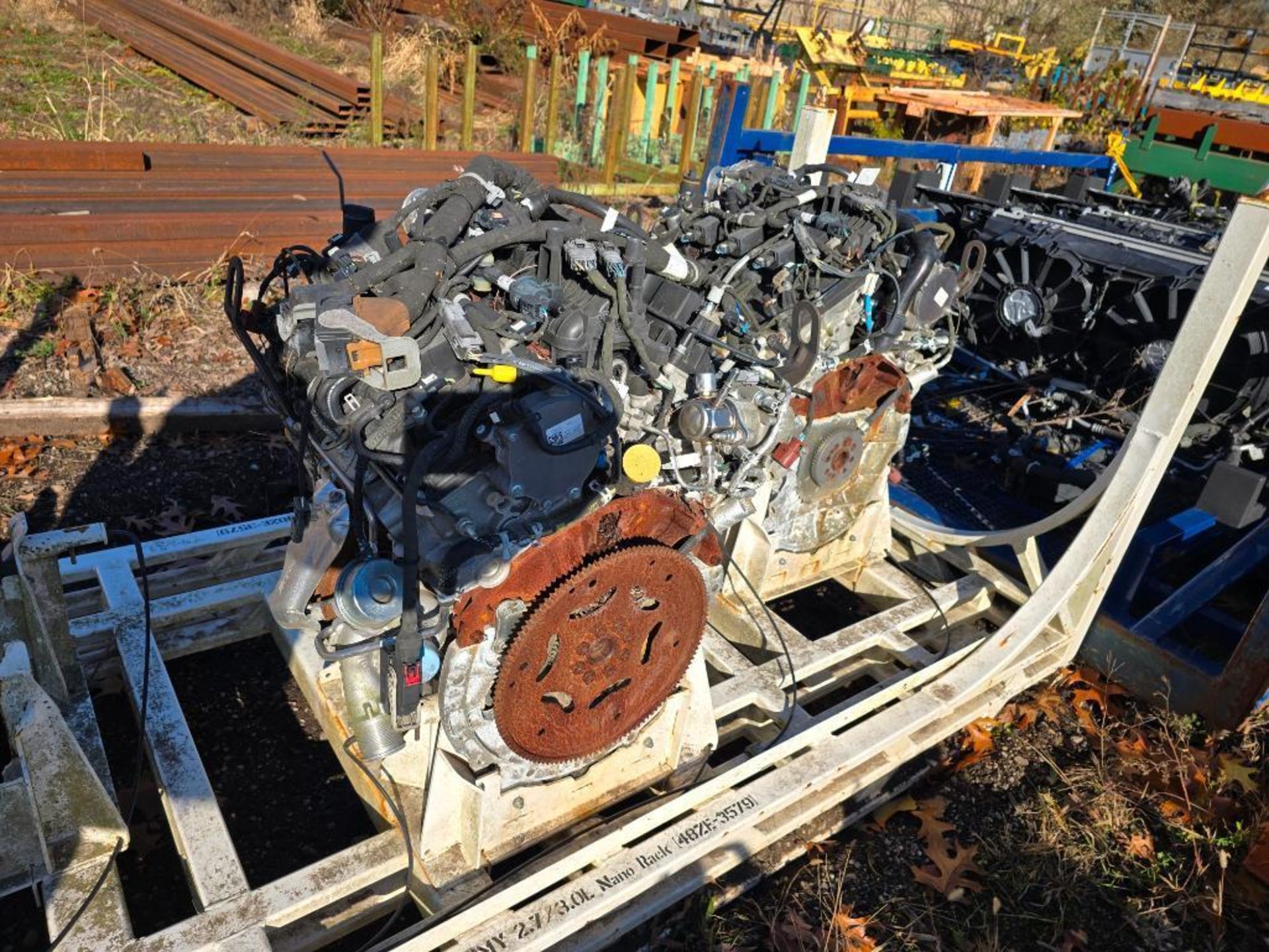 (4) Racks w/ (5) Ford Test Engines & (6) Dodge Truck Front End ...