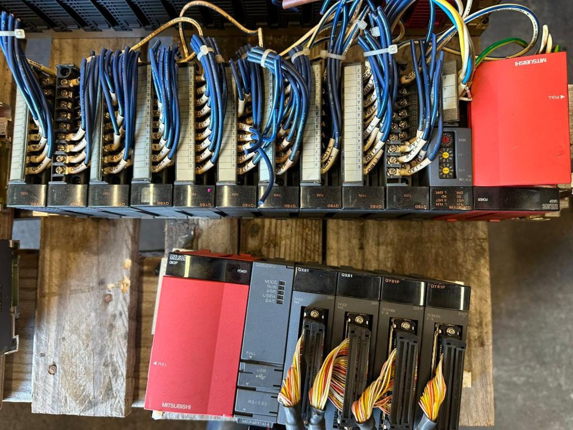 (F) Pallet of Mitsubishi Racks