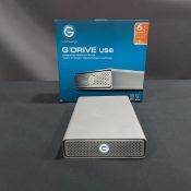 GDRIVE, G1, USB, COMPACT, 6,000 GB, HIGH PERFORMANCE STORAGE HARDRIVE, S/N V8HHW59R (TAG 32)