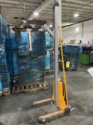 YELLOW BATTERY OPERATED ROLL LIFTER ON WHEELS