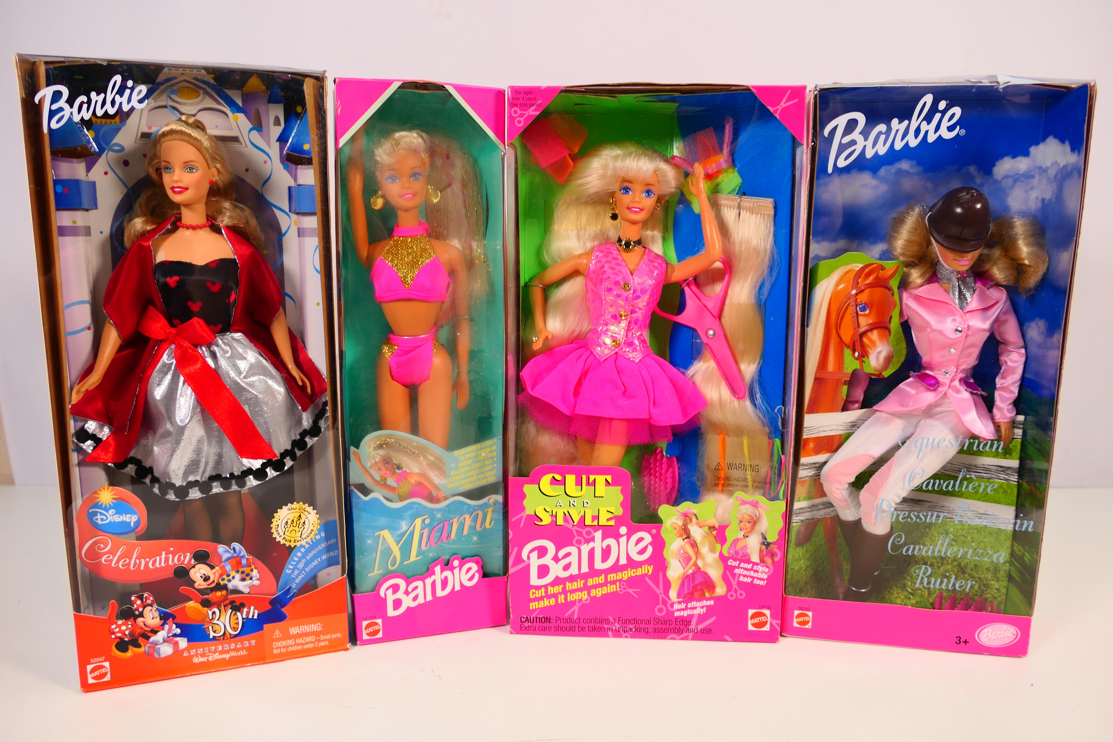 Mattel - Barbie - A boxed collection of four Barbie dolls, consisting ...