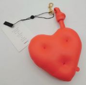 An Anya Hindmarch Heart-Shaped Leather Pouch. Bright red leather exterior with cross-stitch