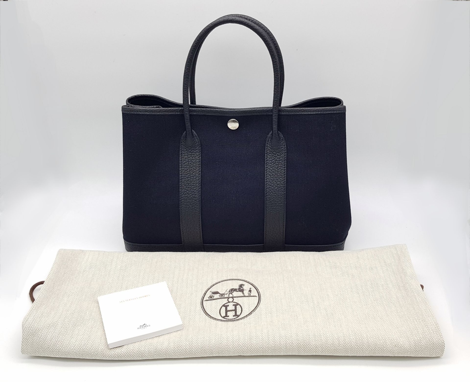 A Hermès Garden Party 30 Black Canvas and Leather Tote Bag. Black canvas exterior with black - Image 7 of 12