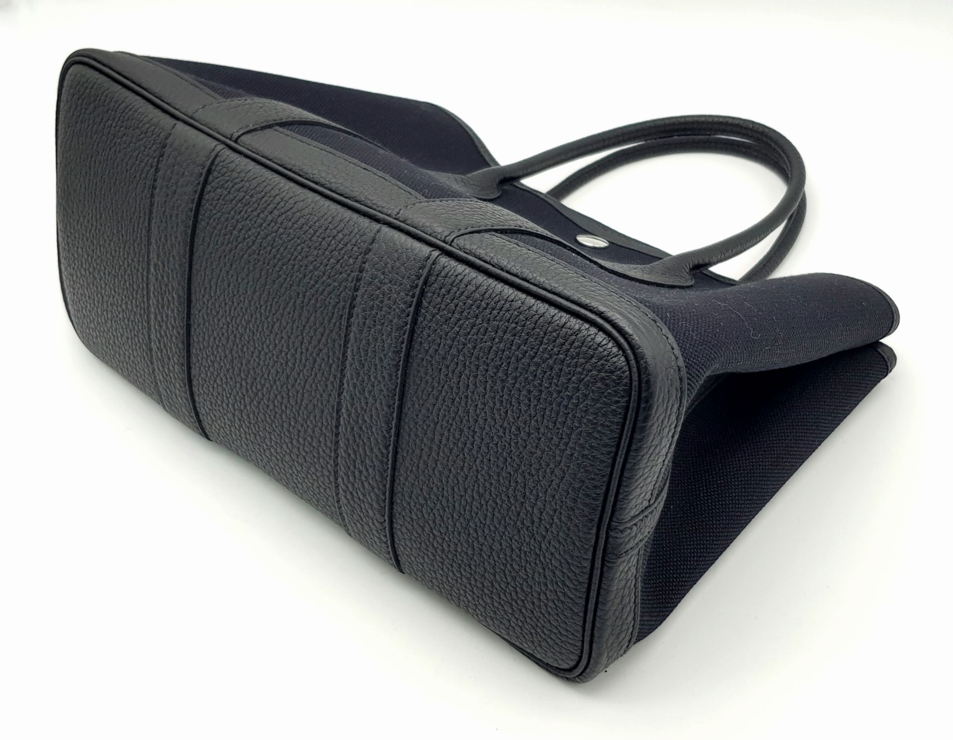 A Hermès Garden Party 30 Black Canvas and Leather Tote Bag. Black canvas exterior with black - Image 6 of 12