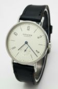 A Nomos Glashutte Automatic Gents Watch. Black leather strap. Stainless steel case - 36mm. White