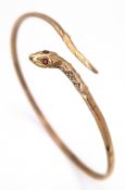 A ONE EYED SNAKE BANGLE (ONE EYE STONE IS MISSING) . 4.76gms