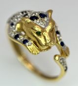 An 18K YELLOW GOLD DIAMOND AND SAPPHIRE SET PANTHER RING. ONE STONE MISSING. 4.6G SIZE L. Ref: 9983