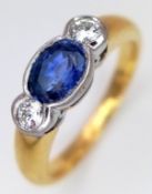 An 18K YELLOW GOLD DIAMOND AND SAPPHIRE RING 0.30CT DIAMONDS AND 0.50CT OVAL SAPPHIRE 5.3G SIZE N