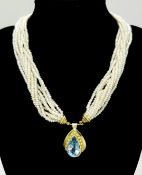 A MULTISTRAND FRESHWATER PEARL NECKLACE WITH 18K YELLOW PENDANT CLASP SET WITH DIAMONDS AND BLUE