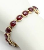 A Vintage Gilded Sterling Silver Garnet Set Tennis Bracelet- 21cm Length. Set with Nineteen 9mm Long
