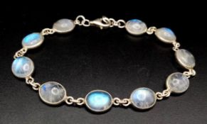 A Very Attractive Sterling Silver and Moonstone Set Tennis Bracelet- 20.5cm Length. Set with Ten 1cm