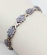 An Eye-Catching Sterling Silver and Tanzanite Set Tennis Bracelet-20cm Length, 7mm Width. Set with