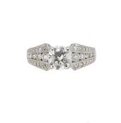 A single stone diamond ring with diamond set shoulders,