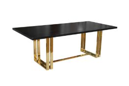 A BLACK STAINED WOOD AND BRASS DINING TABLE, 21ST CENTURY