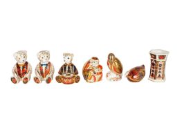 A GROUP OF SIX ROYAL CROWN DERBY PAPERWEIGHTS TOGETHER WITH A VASE