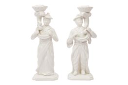 A PAIR OF CONTEMPORARY BLANC DE CHINE FIGURAL CANDLESTICKS BY D&P, ITALY