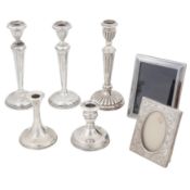 A group of sterling silver filled candlesticks