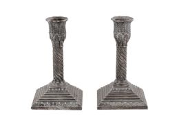 A pair of Edwardian sterling silver dwarf candlesticks, Sheffield 1901 by Martin, Hall, and Co